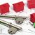House buying. House keys on a housing plan with green and red model houses.