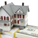 model of the house and us dollars on white background, selective focus, finance or rental concept