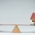 seesaw-with-piggy-bank-and-house-e1424292381162